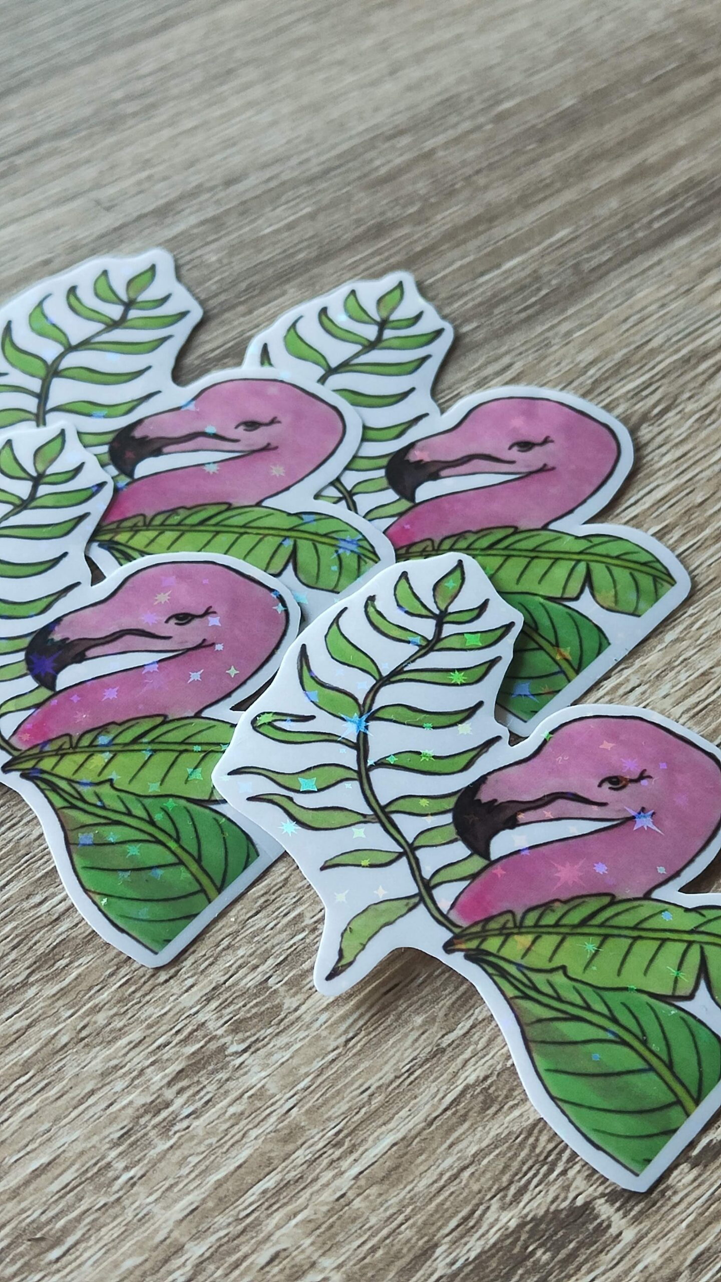 Four holographic flamingo sticlers.