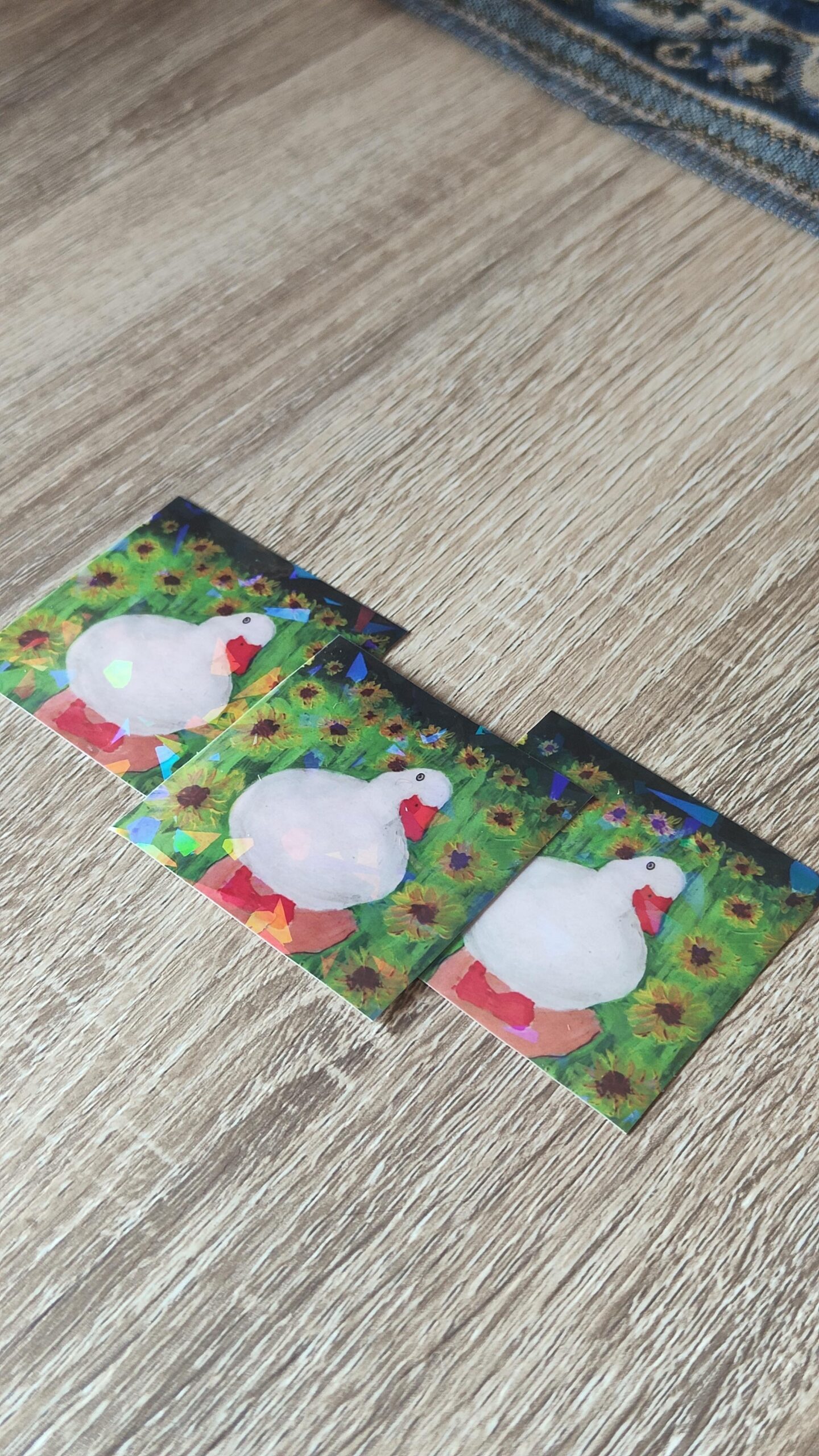 Three holographic stickers of ducks.