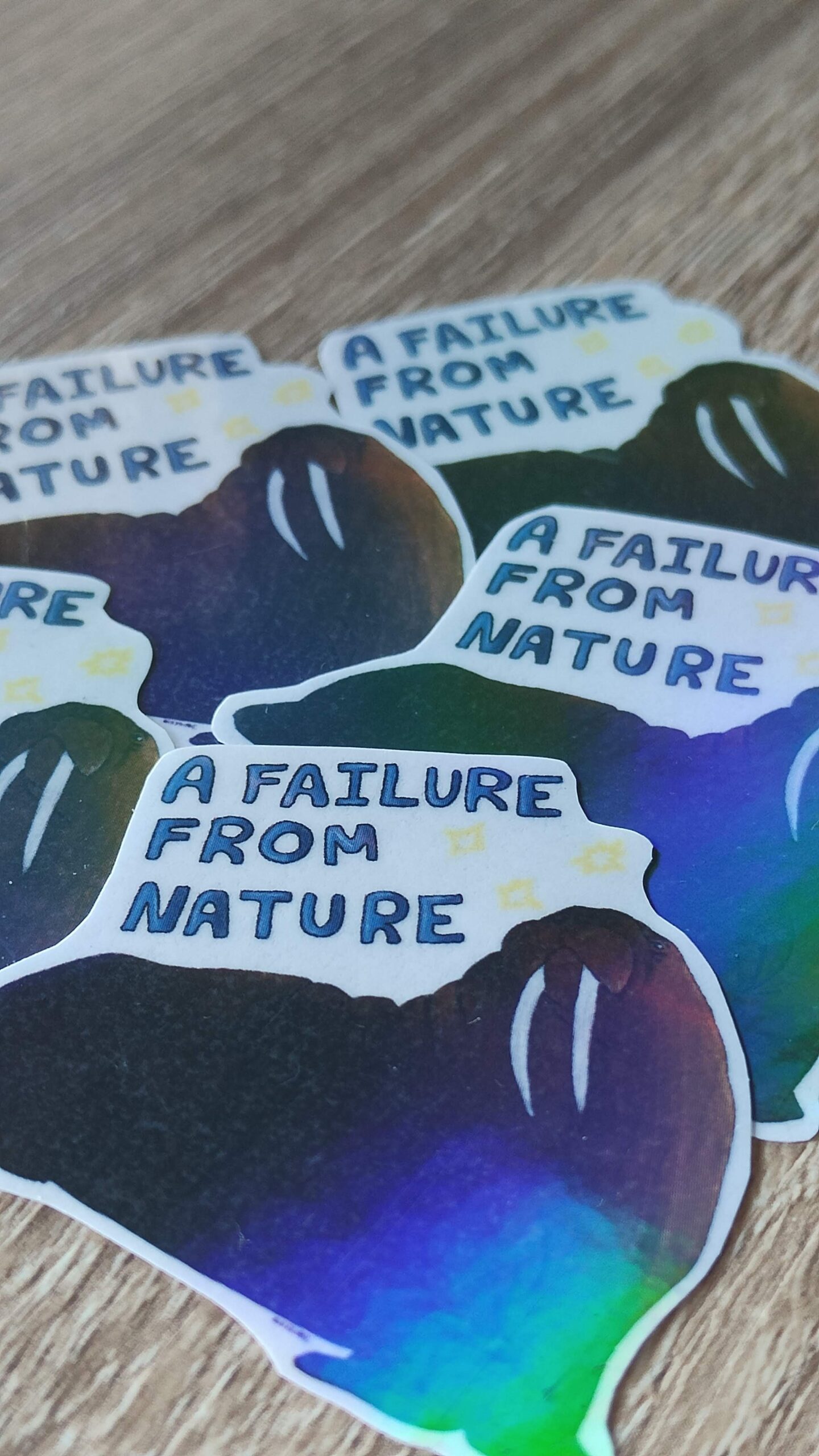 Five holographic stickers of a walrus.